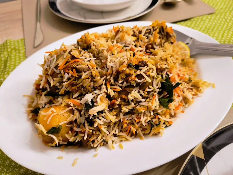 A plate of colourful biryani